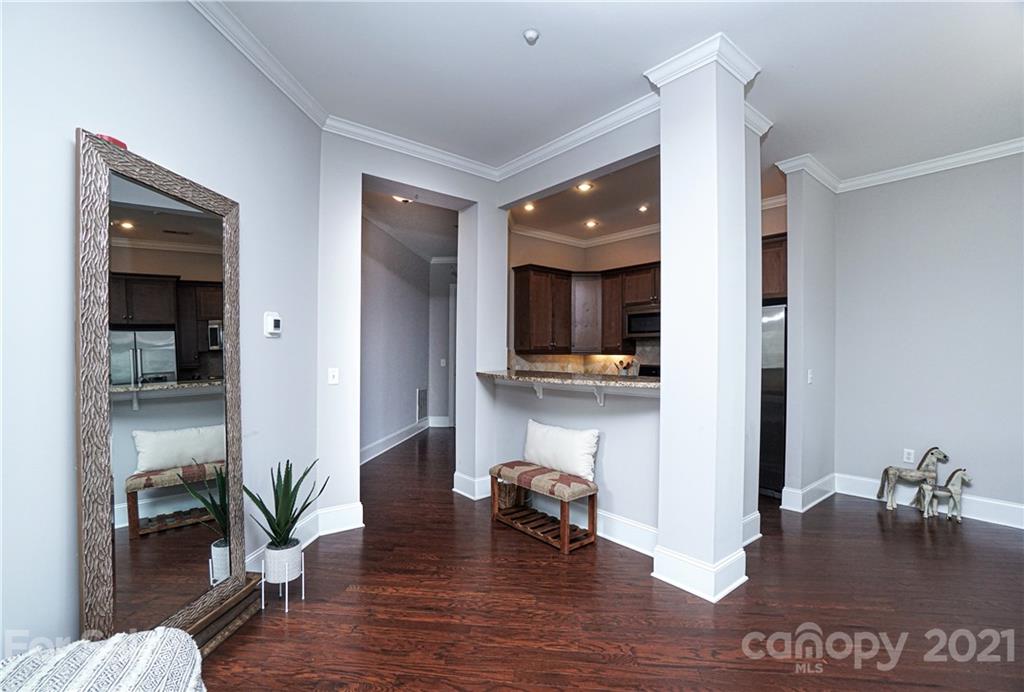 5425 Closeburn Road, Unit 103 Charlotte, NC 28210 - Photo 12 of 39 a living room with furniture and a view of kitchen