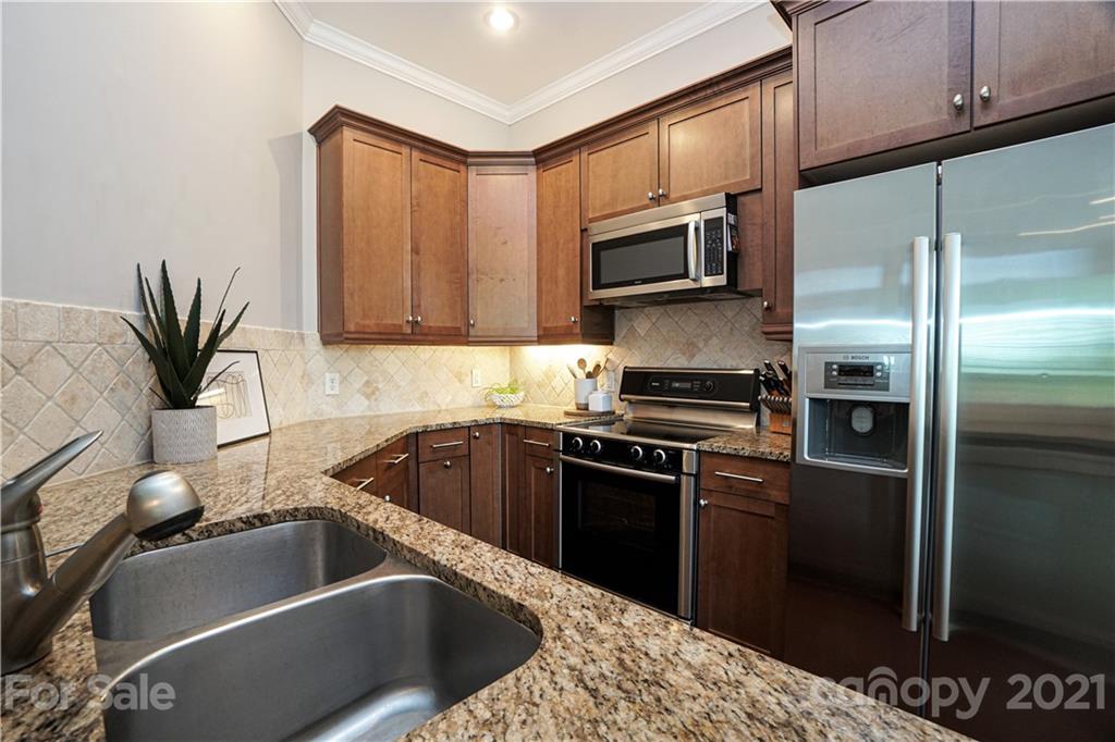 5425 Closeburn Road, Unit 103 Charlotte, NC 28210 - Photo 14 of 39 a kitchen with a refrigerator sink and microwave