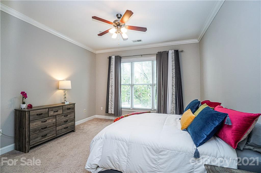 5425 Closeburn Road, Unit 103 Charlotte, NC 28210 - Photo 18 of 39 a bedroom with a bed and a couch