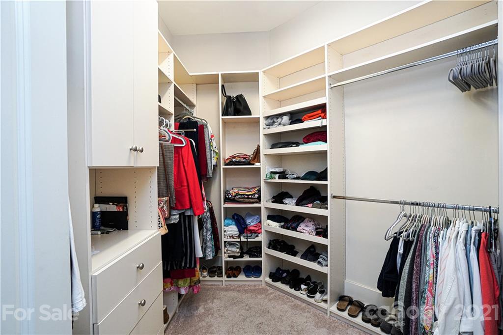 5425 Closeburn Road, Unit 103 Charlotte, NC 28210 - Photo 22 of 39 a view of walk in closet with clothes and shoes