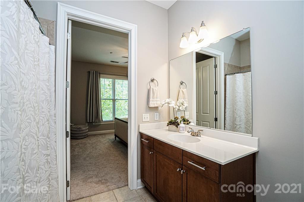 5425 Closeburn Road, Unit 103 Charlotte, NC 28210 - Photo 26 of 39 a bathroom with a sink and a mirror