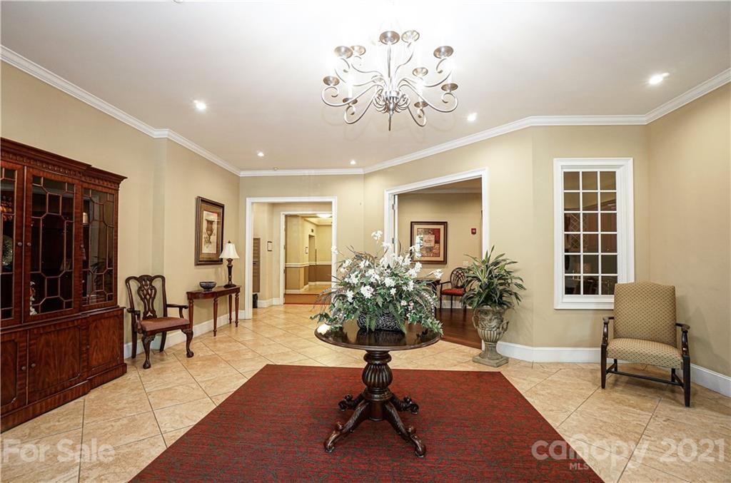 5425 Closeburn Road, Unit 103 Charlotte, NC 28210 - Photo 36 of 39 a living room with furniture flowers and a window