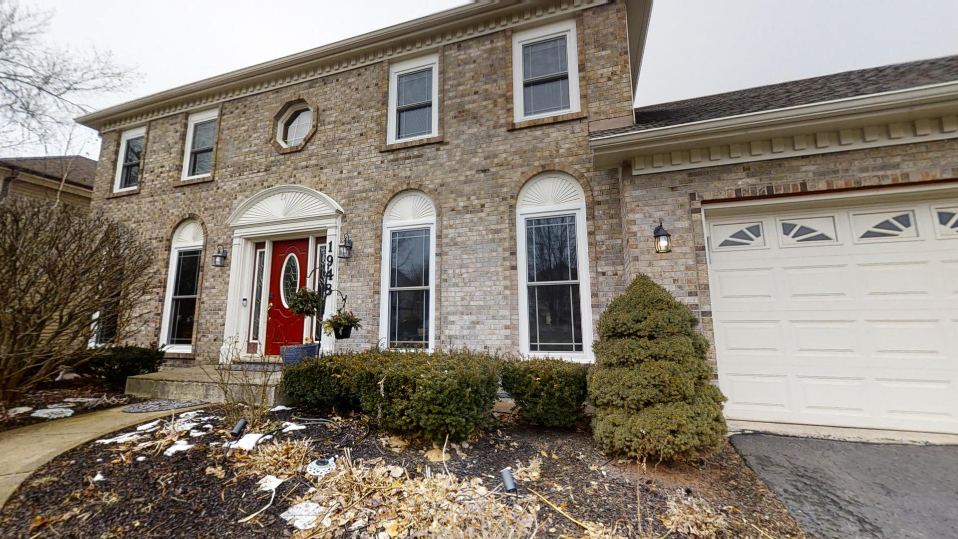 1948 Slippery Rock Road Naperville, IL 60565 - Photo 4 of 61 a view of a brick house with large windows