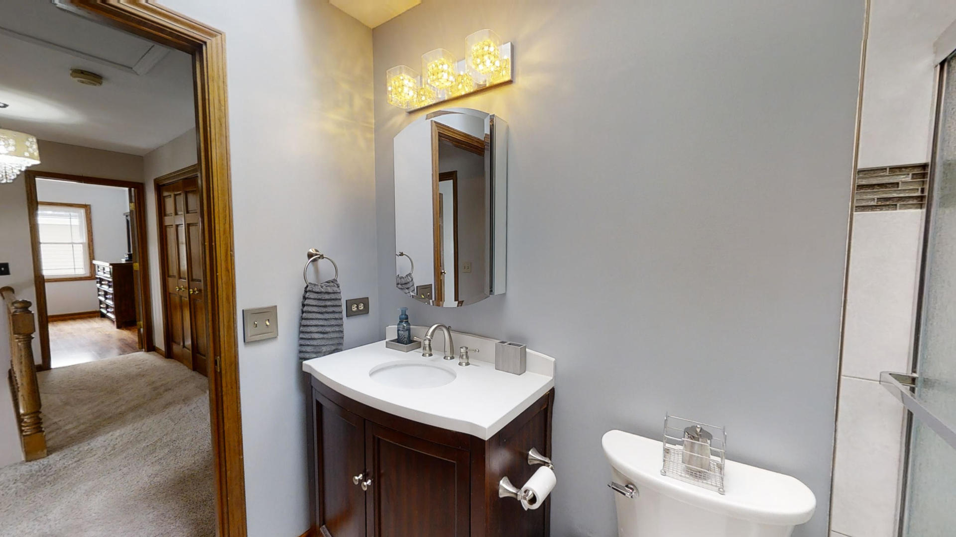 1948 Slippery Rock Road Naperville, IL 60565 - Photo 46 of 61 a bathroom with a toilet sink and mirror