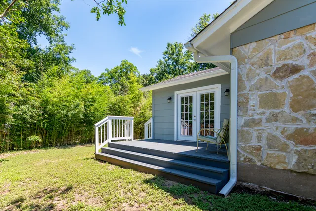 a bed room with a bed and a window
