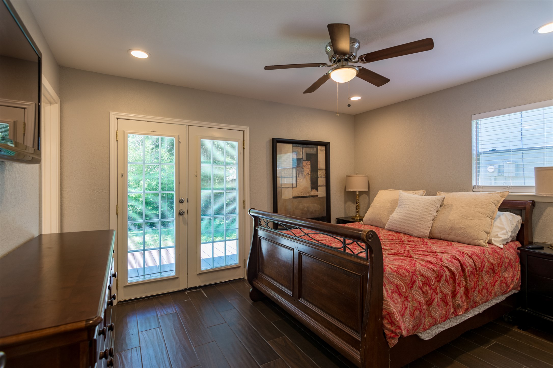 11705 Natrona Drive Austin, TX 78759 - Photo 20 of 35 Bedroom featuring french doors, dark wood-style flooring, access to outside, ceiling fan, and recessed lighting