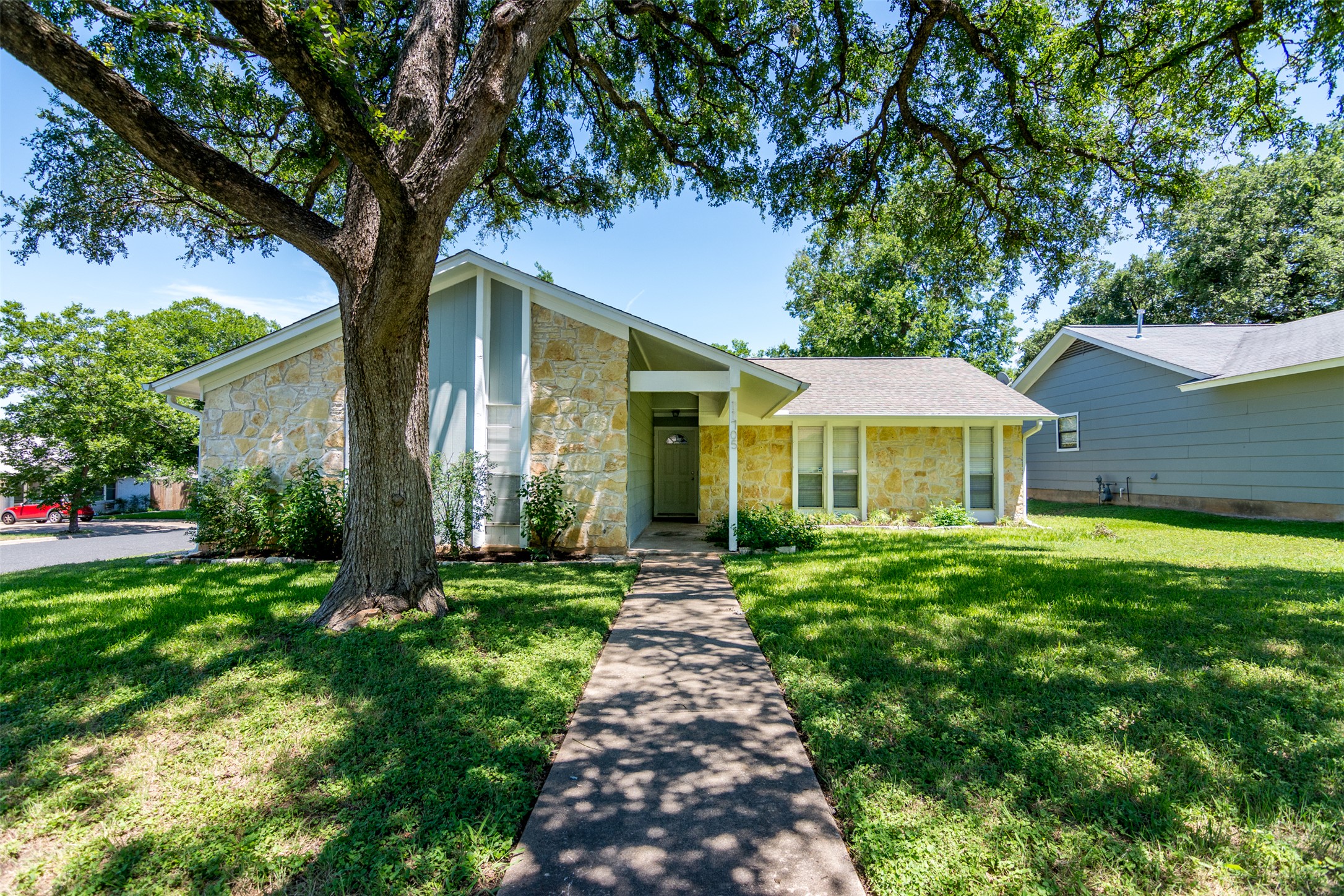 11705 Natrona Drive Austin, TX 78759 - Photo 24 of 35 Mid-century inspired home featuring stone siding and a front yard