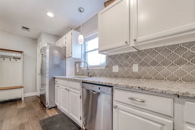 a bed room with a bed and a television