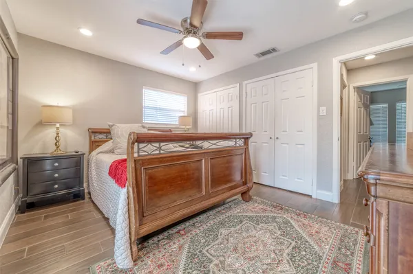 a bed room with a bed and a window