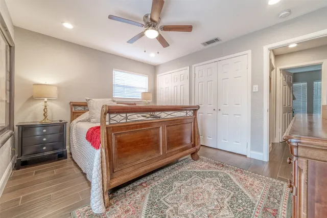 a bed room with a bed and a window