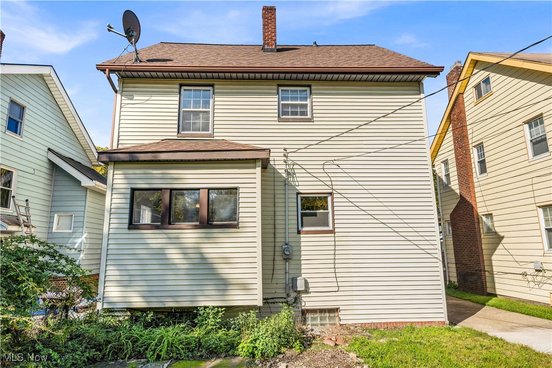 945 Nela View Road Cleveland Heights, OH 44112 - Photo 27 of 27 Back of house with roof with shingles and a chimney