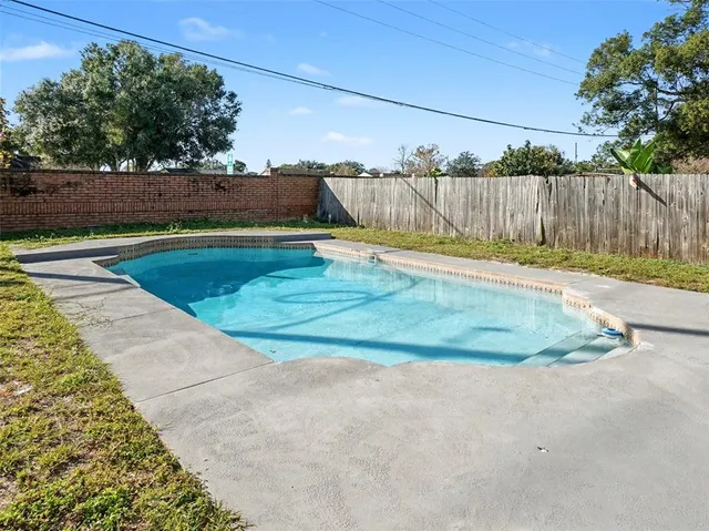 a view of a field with trees and grass