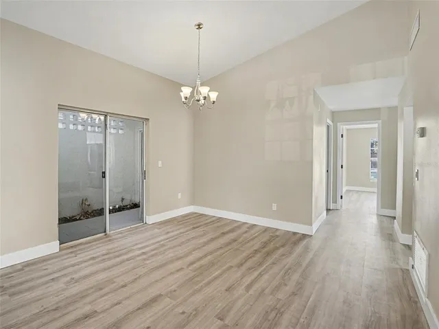 a kitchen with stainless steel appliances a stove microwave and sink