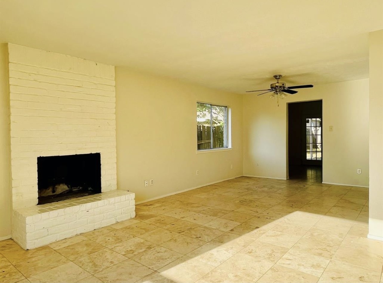 24022 Spring Fork Drive Spring, TX 77373 - Photo 18 of 23 a view of a livingroom with a fireplace and a flat screen tv