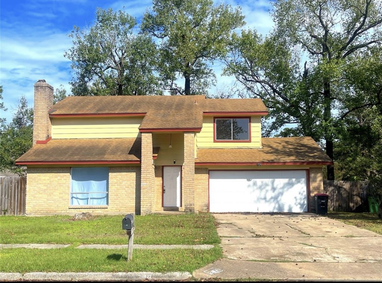 24022 Spring Fork Drive Spring, TX 77373 - Photo 2 of 23 a front view of a house with a yard