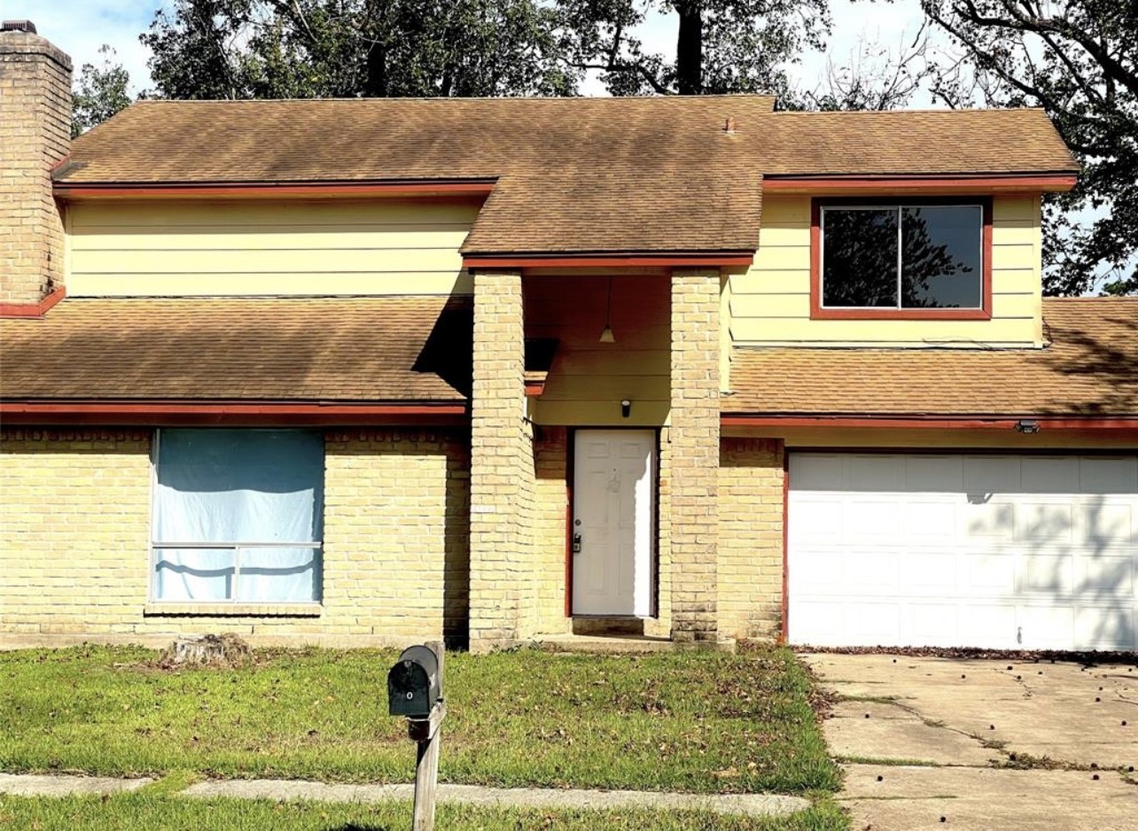 24022 Spring Fork Drive Spring, TX 77373 - Photo 3 of 23 a front view of a house with a yard