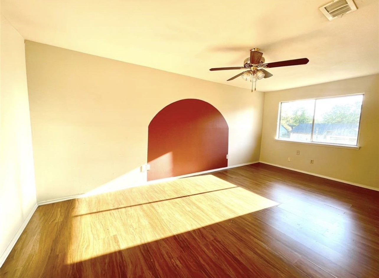 24022 Spring Fork Drive Spring, TX 77373 - Photo 7 of 23 a view of a room with wooden floor and a window