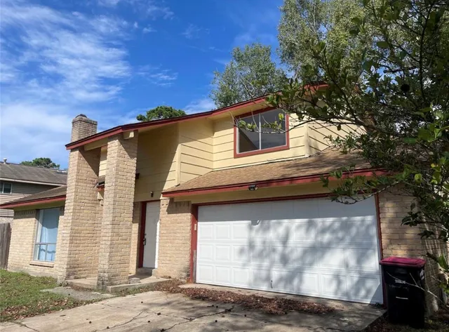 a view of a house with a garage