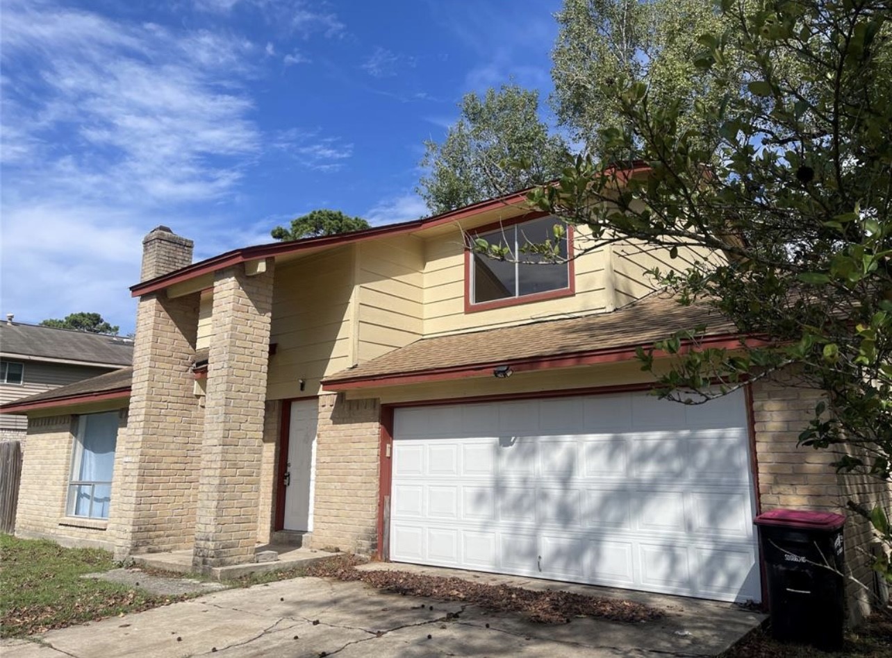 24022 Spring Fork Drive Spring, TX 77373 - Photo 8 of 23 a view of a house with a garage