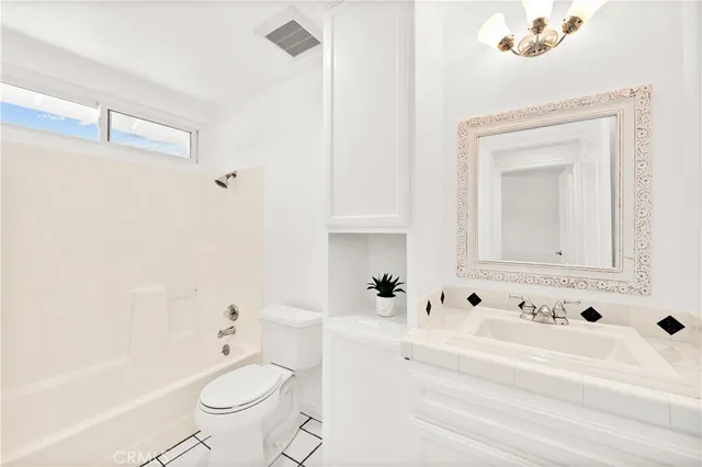 a view of a porch with wooden floor and fence