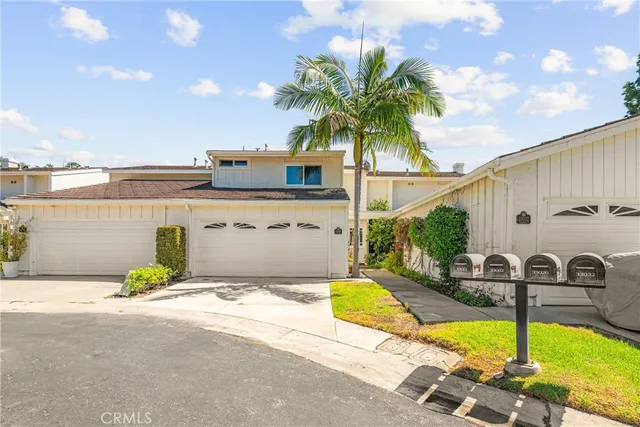 a view of a swimming pool with a patio and a yard