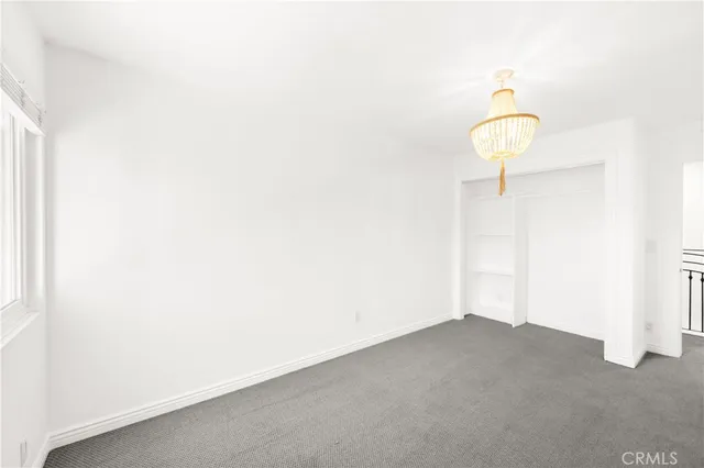 a view of a chair and tables in the balcony