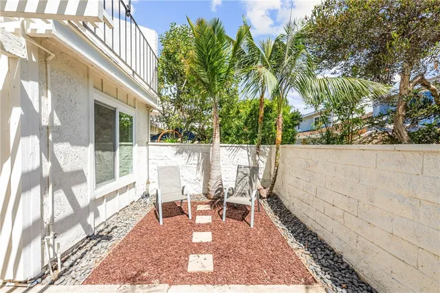 a view of a swimming pool with a patio and a yard