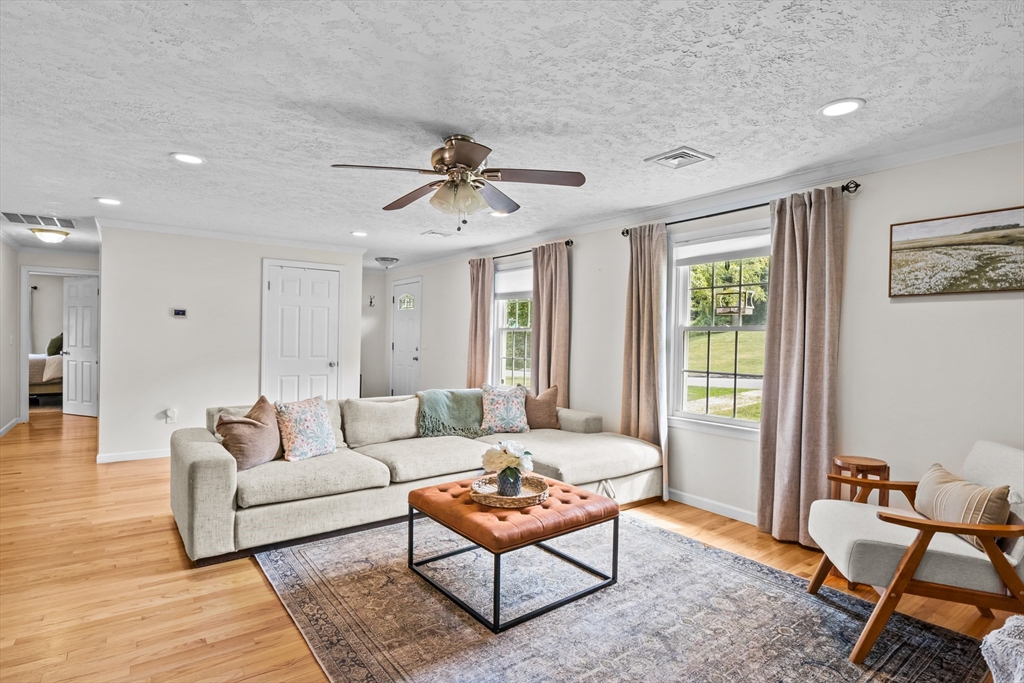 40 Crest Road Monson, MA 01057 - Photo 3 of 34 a living room with furniture a ceiling fan a rug and a window