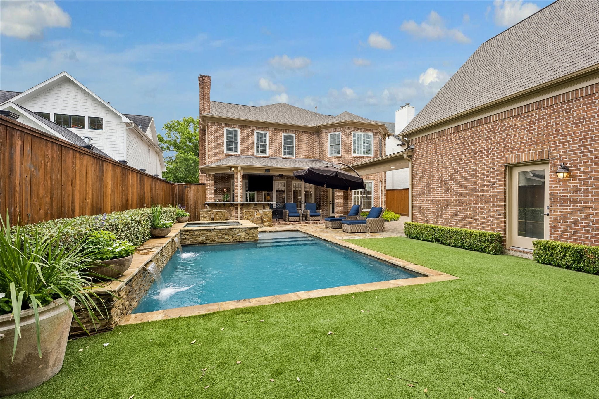6358 Auden Street Houston, TX 77005 - Photo 36 of 50 a view of an house with swimming pool garden and patio
