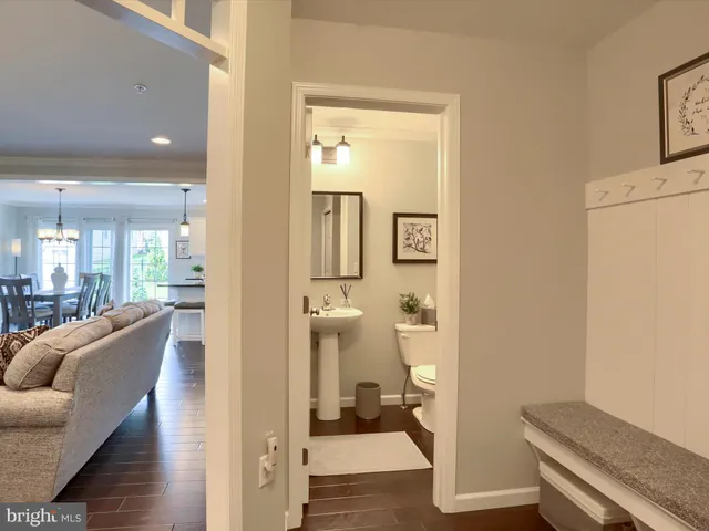 a view of a room with wooden floor and furniture