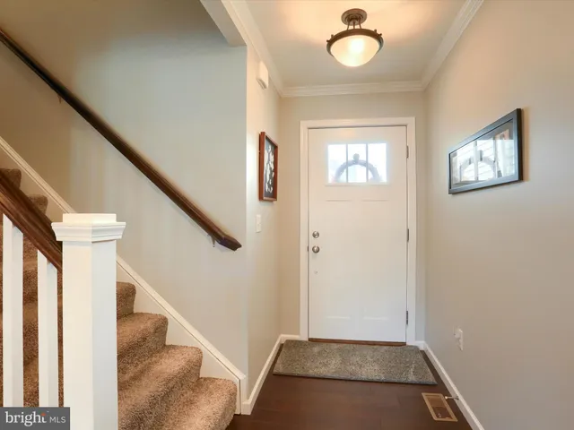 a view of an entryway with wooden floor