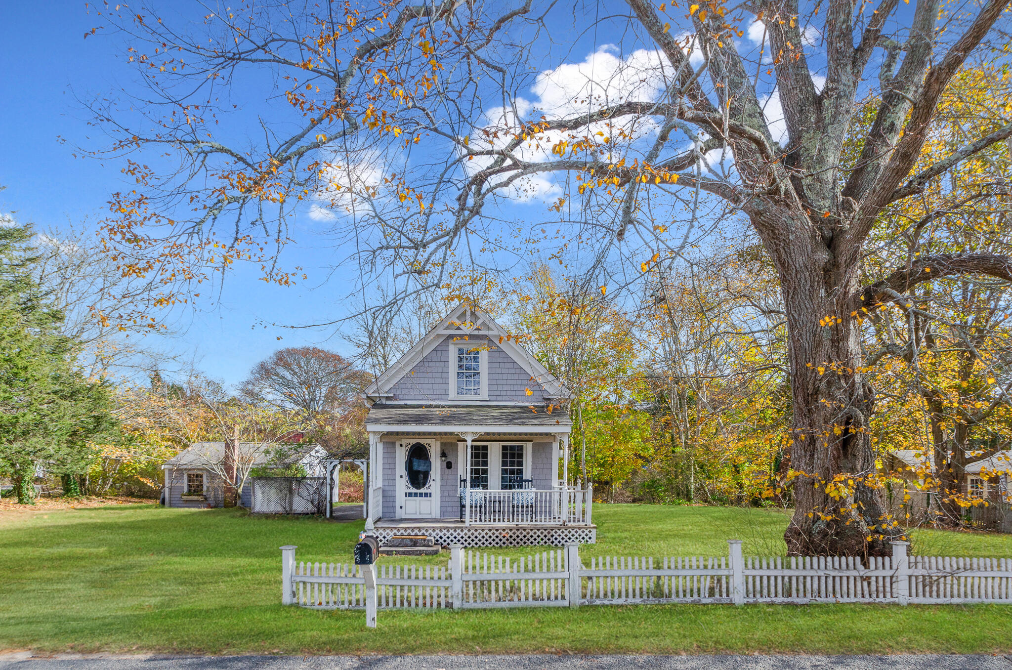 a front view of a house with a garden