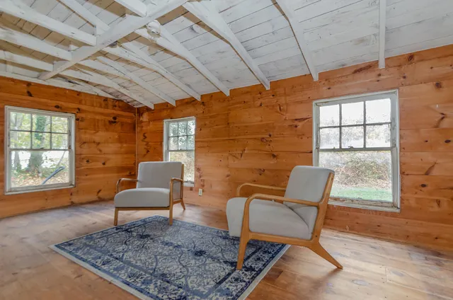 a living room with furniture and a rug