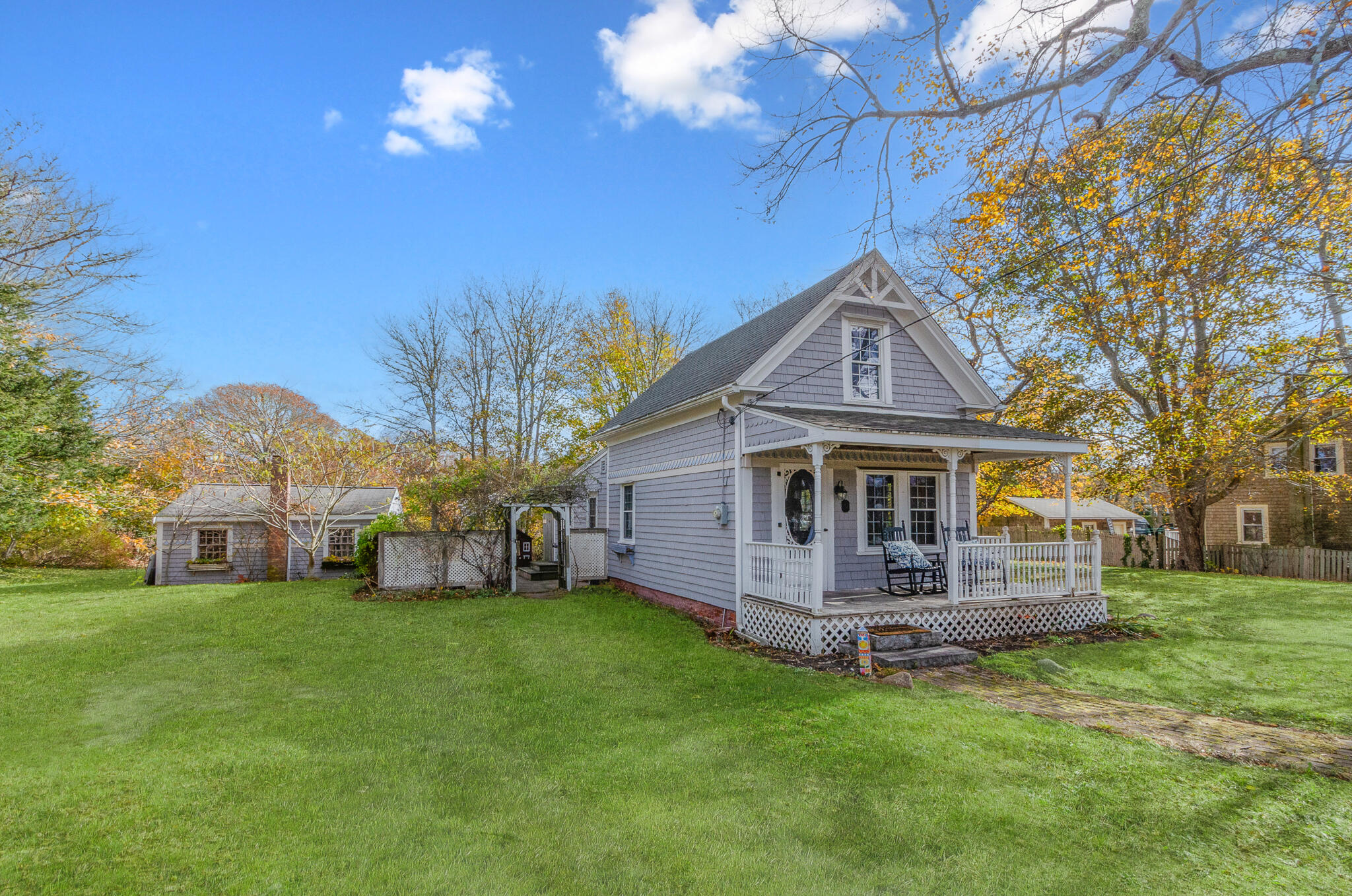 9 Mansion Street West Harwich, MA 02671 - Photo 2 of 26 a front view of house with yard and green space