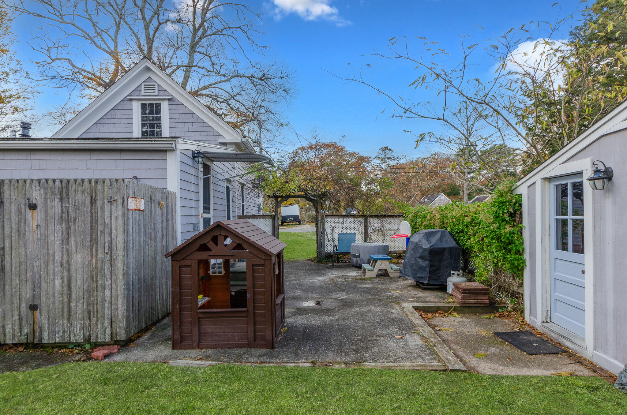 9 Mansion Street West Harwich, MA 02671 - Photo 7 of 26 a view of a barn in the middle of a yard