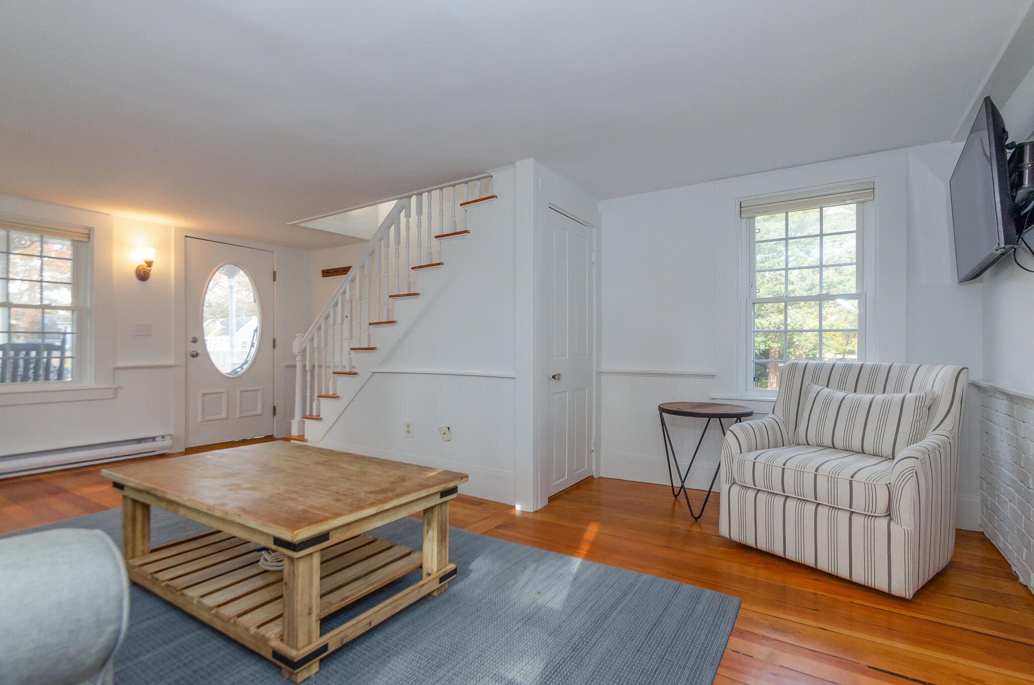 9 Mansion Street West Harwich, MA 02671 - Photo 8 of 26 a living room with furniture a window and wooden floor