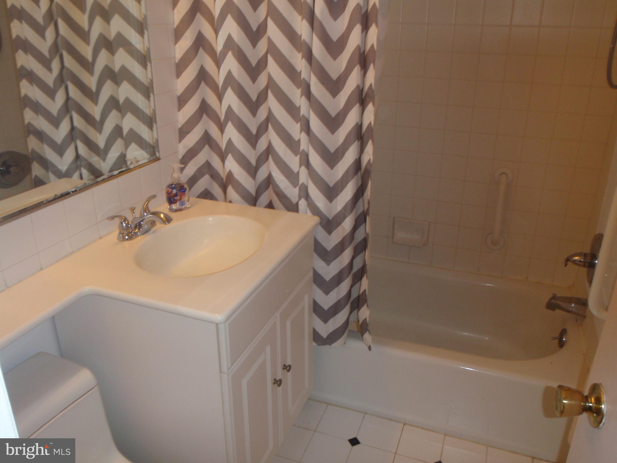 7015 Ridge Avenue, Unit 15 Philadelphia, PA 19128 - Photo 25 of 28 Ceramic tiled bathroom