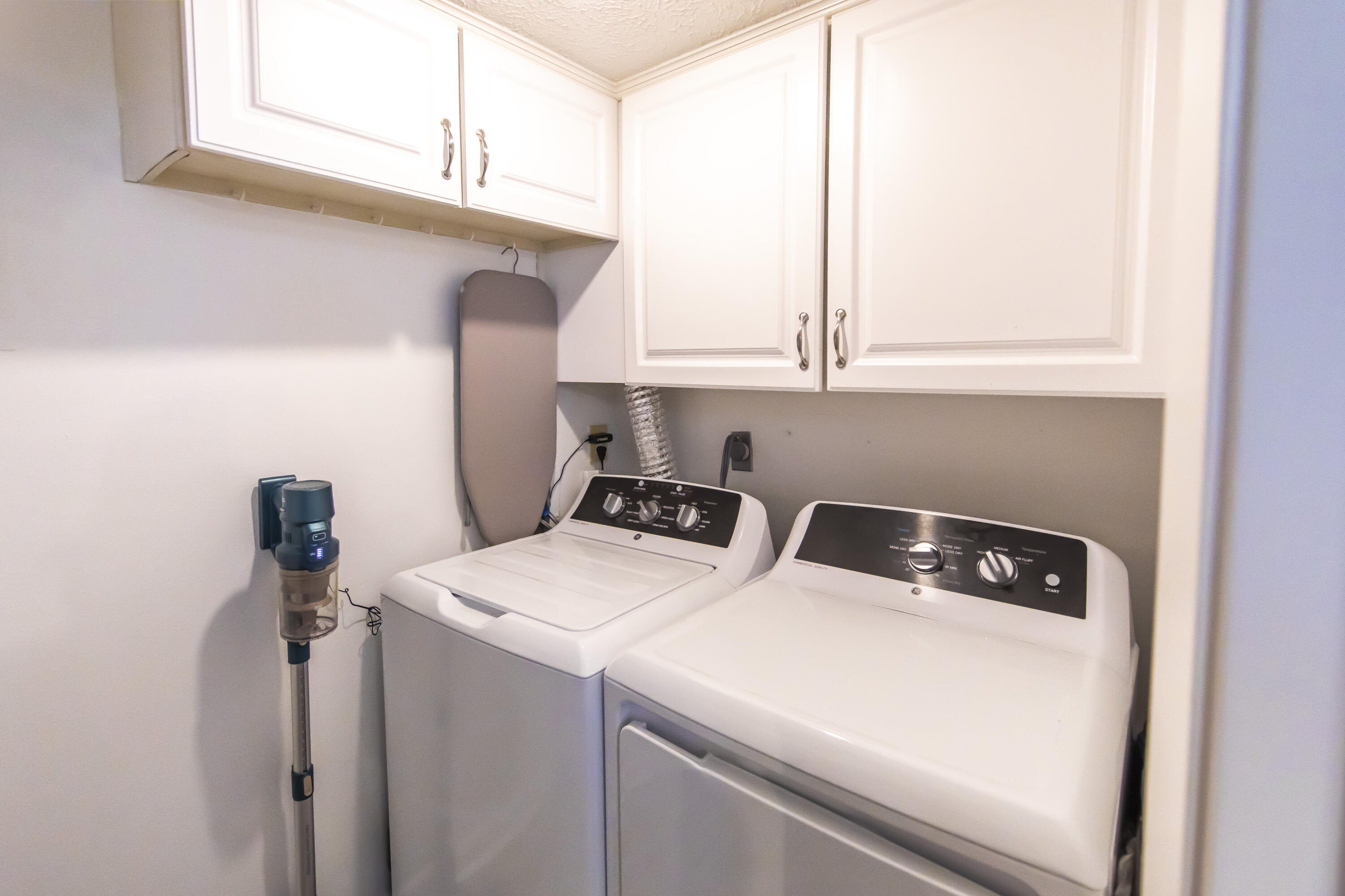 23223 Front Beach Road, Unit A122 Panama City Beach, FL 32413 - Photo 14 of 45 a utility room with dryer and washer