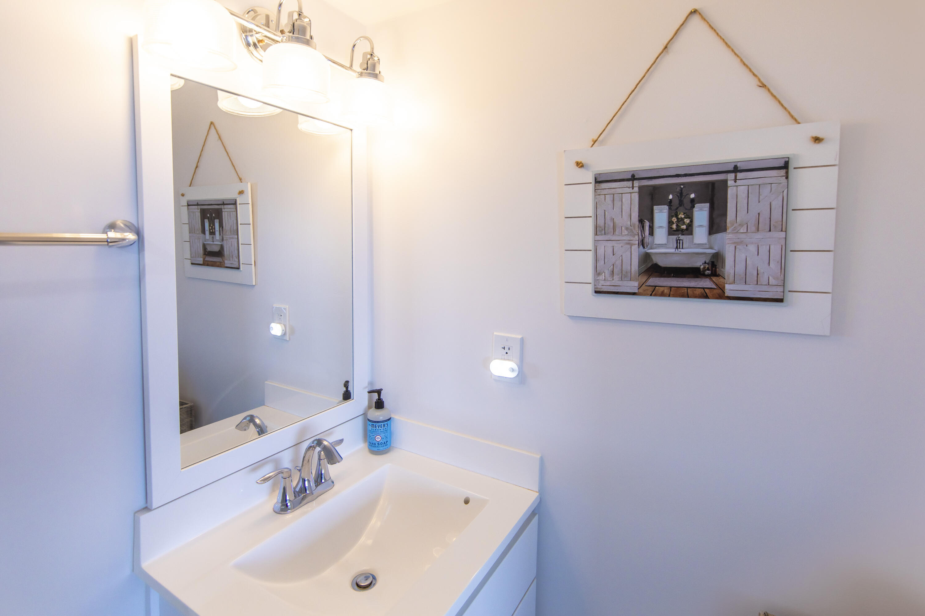23223 Front Beach Road, Unit A122 Panama City Beach, FL 32413 - Photo 19 of 45 a bathroom with a sink and a mirror