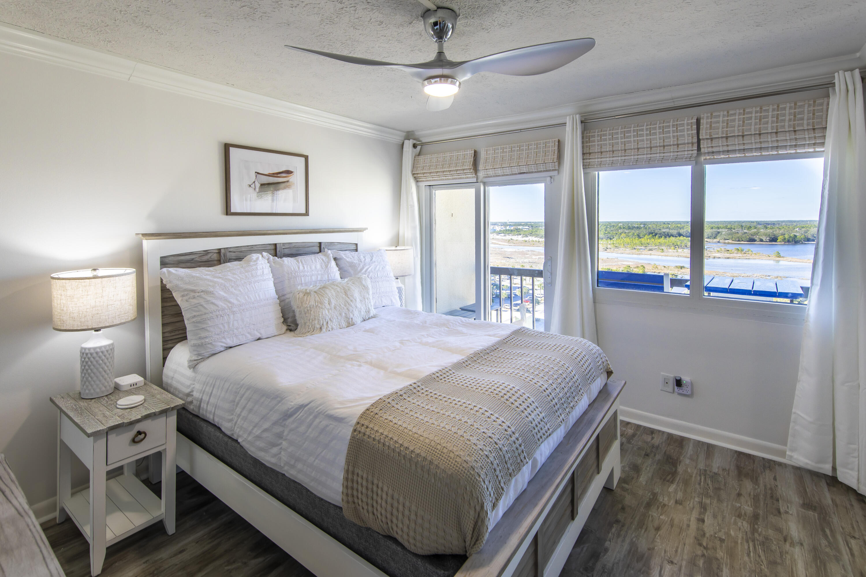 23223 Front Beach Road, Unit A122 Panama City Beach, FL 32413 - Photo 21 of 45 a bedroom with a large bed and a large window