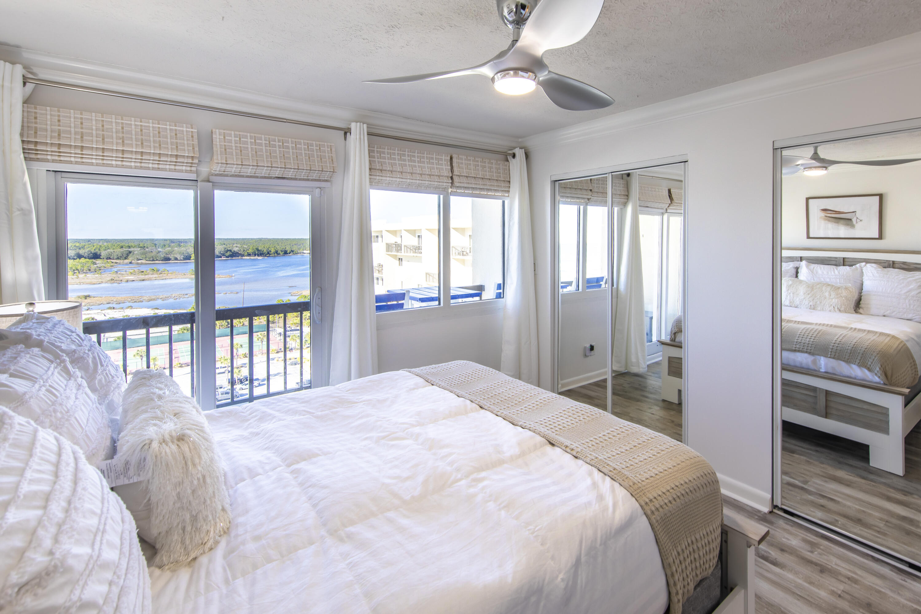 23223 Front Beach Road, Unit A122 Panama City Beach, FL 32413 - Photo 23 of 45 a bedroom with a large bed and a large window