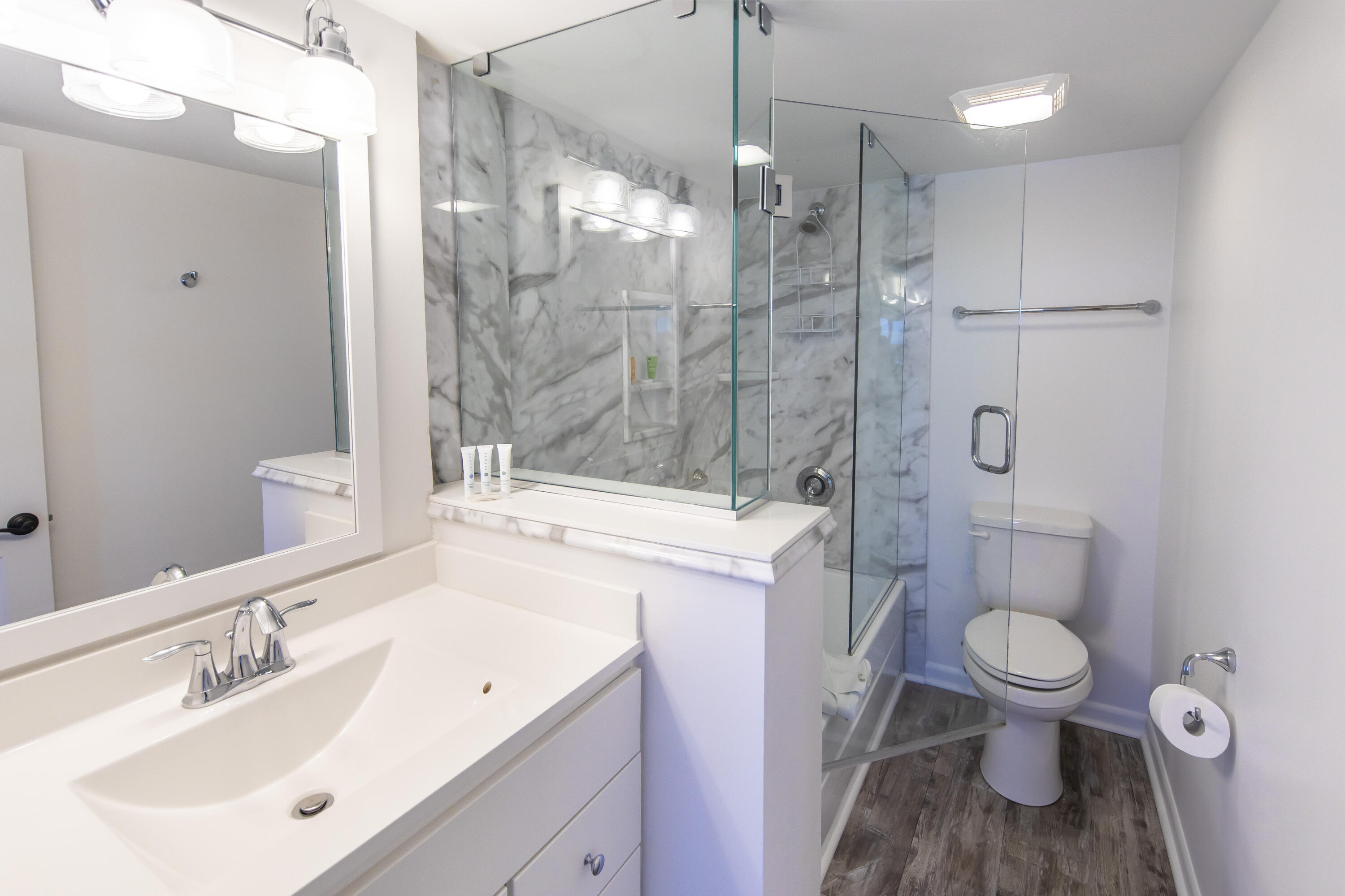 23223 Front Beach Road, Unit A122 Panama City Beach, FL 32413 - Photo 24 of 45 a bathroom with a sink a toilet and shower