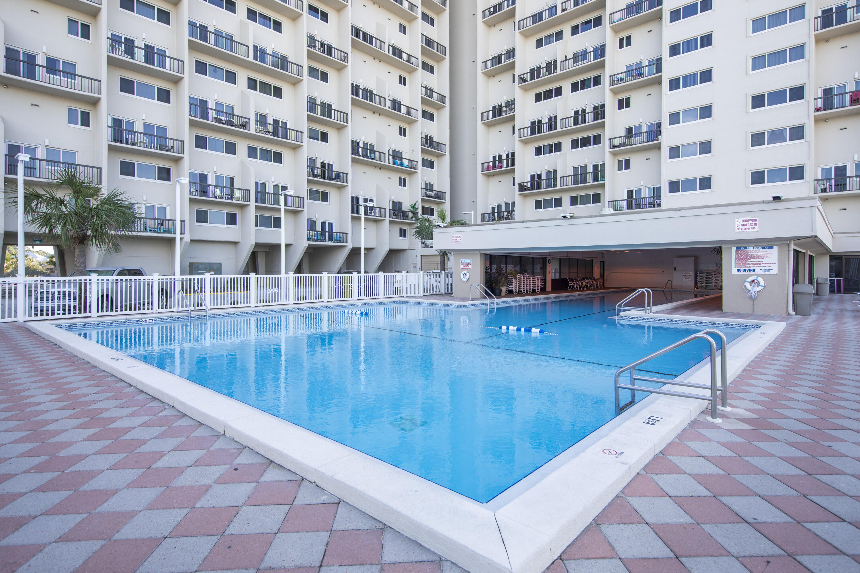 23223 Front Beach Road, Unit A122 Panama City Beach, FL 32413 - Photo 35 of 45 a view of a swimming pool with a patio
