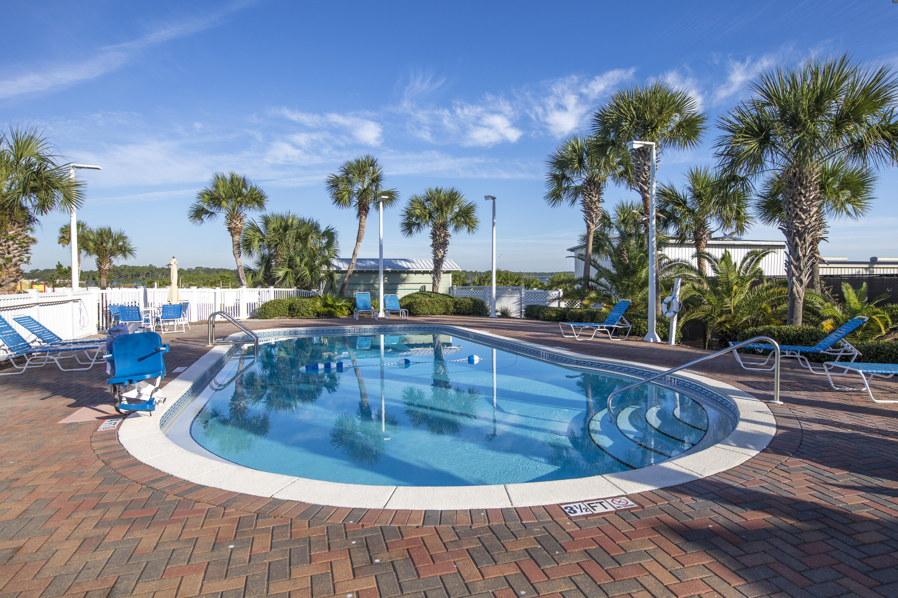 23223 Front Beach Road, Unit A122 Panama City Beach, FL 32413 - Photo 37 of 45 a view of a swimming pool with an outdoor seating