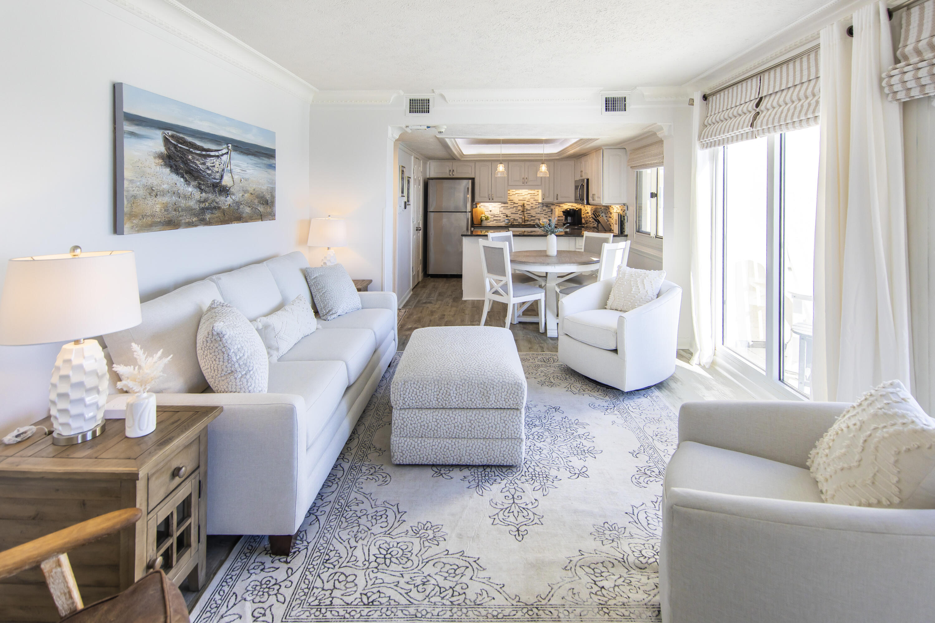 23223 Front Beach Road, Unit A122 Panama City Beach, FL 32413 - Photo 4 of 45 a living room with furniture and a large window