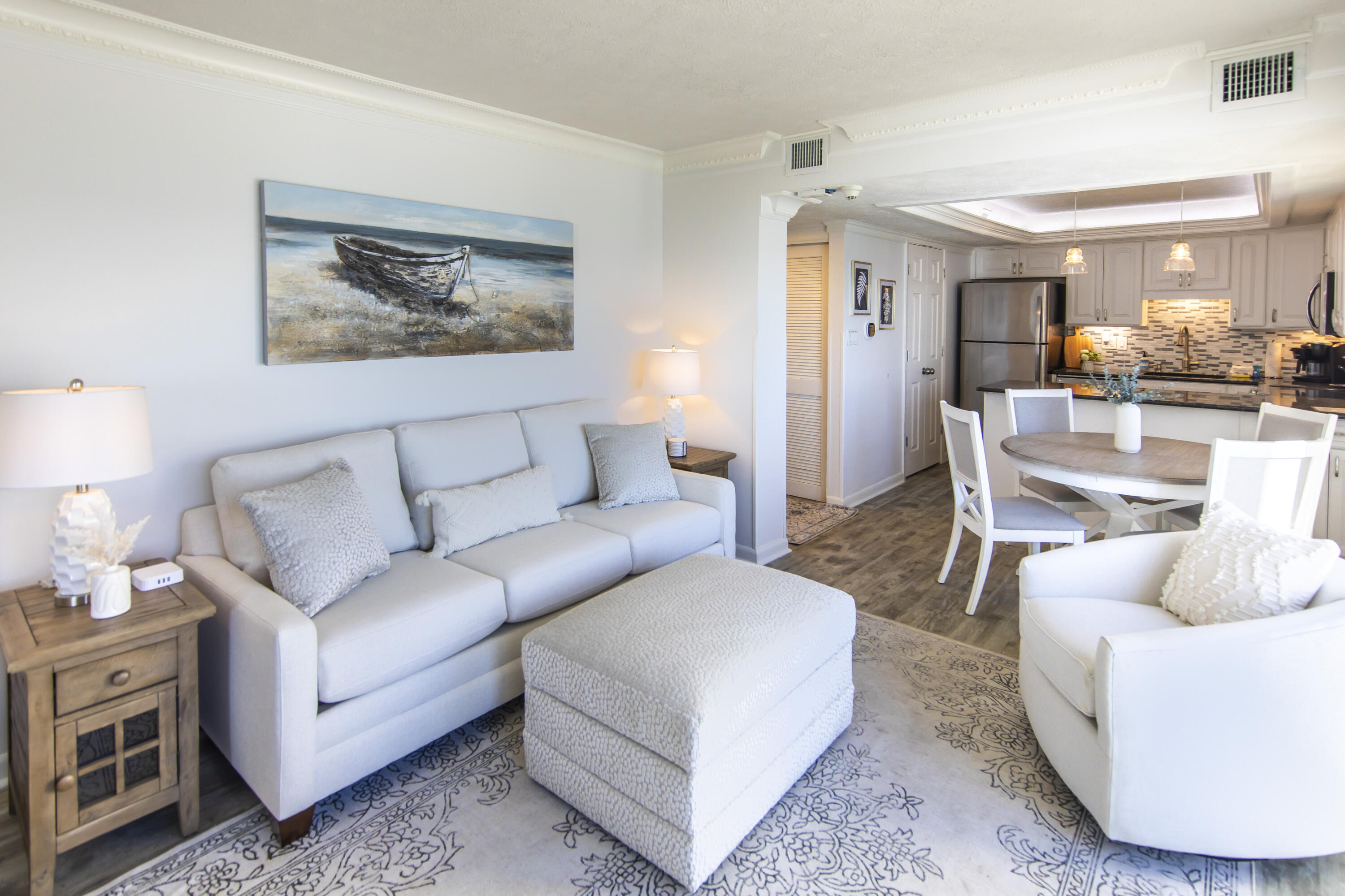 23223 Front Beach Road, Unit A122 Panama City Beach, FL 32413 - Photo 6 of 45 a living room with furniture and a wooden floor