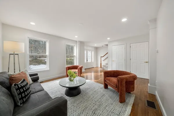 a living room with furniture and a table