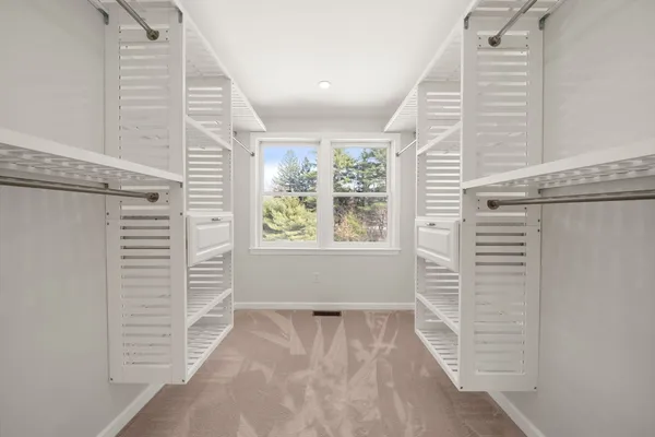 a view of walk in closet with window