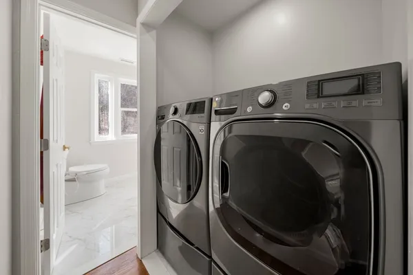a utility room with dryer and washer