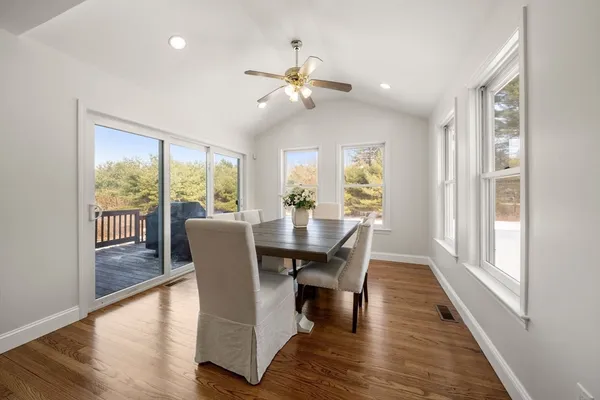 a view of a dining room with furniture window and wooden floor